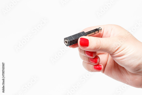 Audio connector holds a female hand