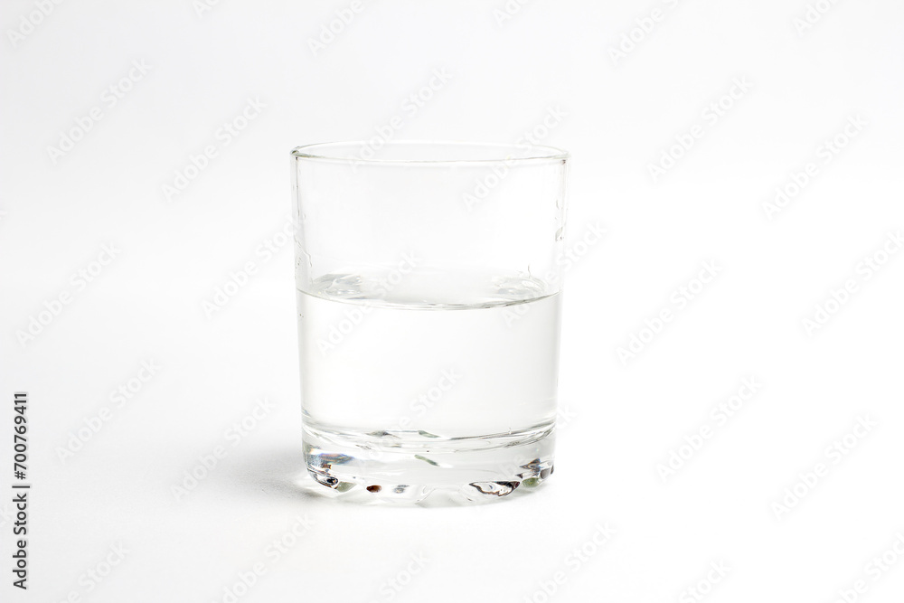 Glass with water on a white background Glass with water on a white background