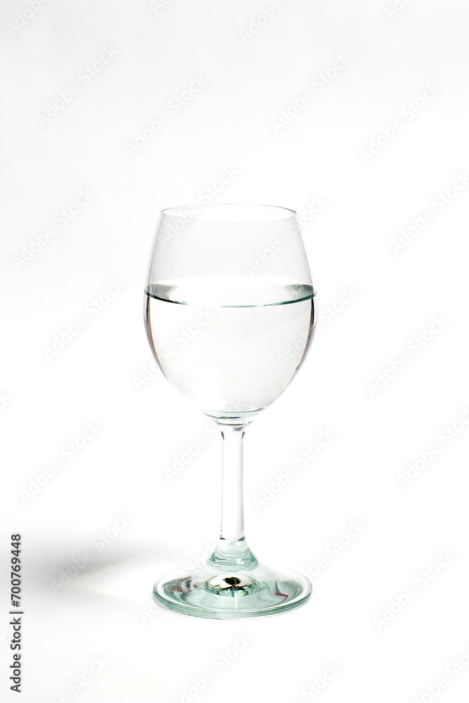 Glass with water on a white background Glass with water on a white background