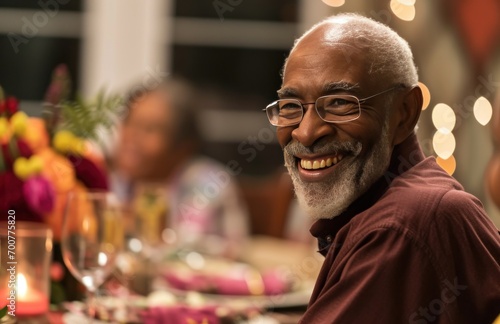 dad smiles at family dinner party,