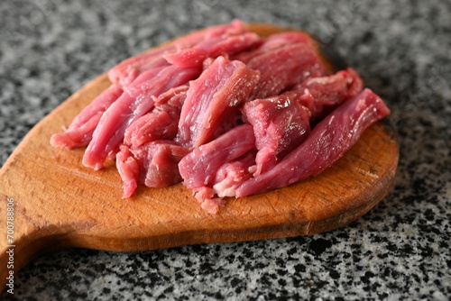 sliced veal strips, beef goulash, red beef meat sliced for cooking photo