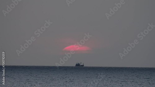 Commercial fisheries, industrial fishery. Fishing trawler. Seascape with ship and sunset photo