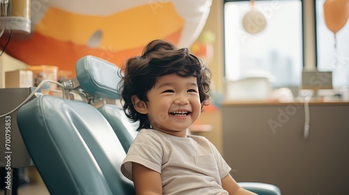 girl patient child sitting in dentist chair smiling photo