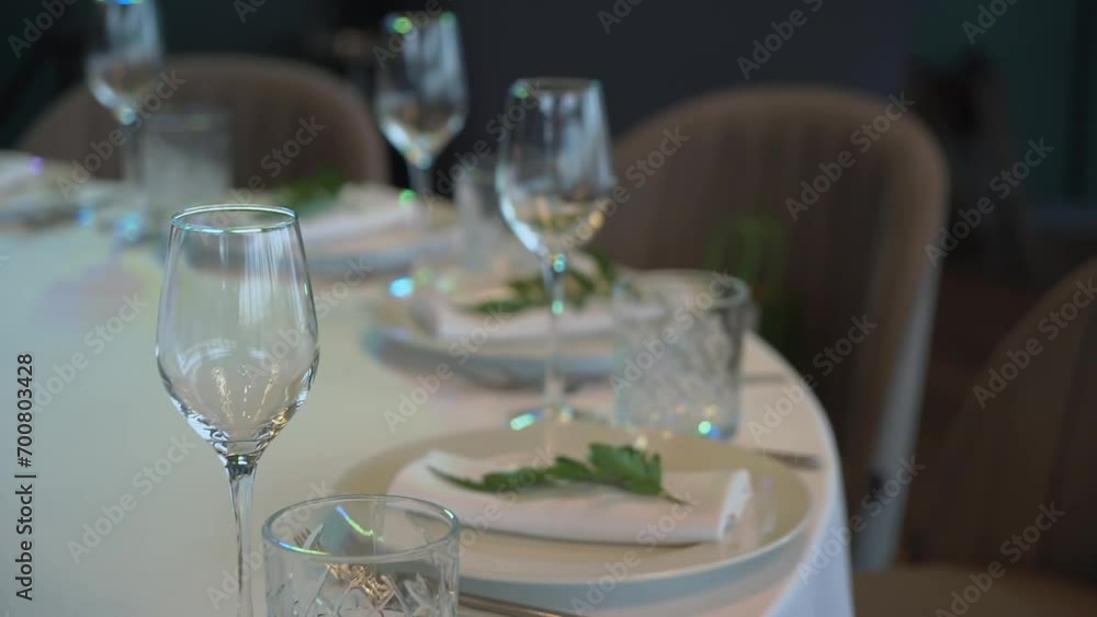 Table Setting for a Wedding Reception with glasses and plates. Indoor reception venue. Table Setting for a Wedding Reception with glasses and plates. Indoor reception venue.
