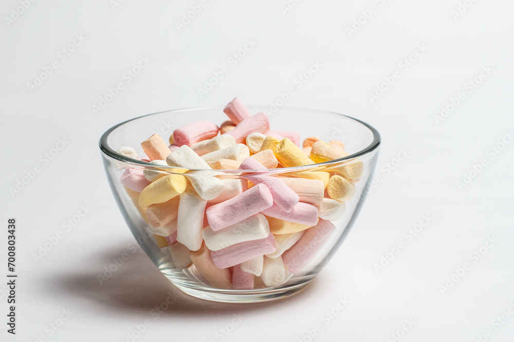 Marshmallows of different colors on a white background Marshmallows of different colors on a white background