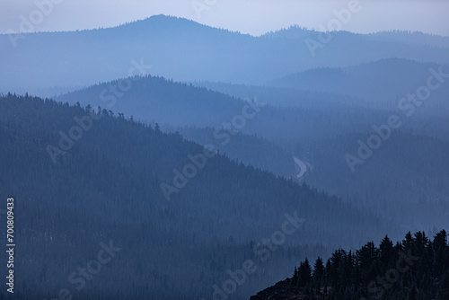 Mountain layers with smoke from a forest fire