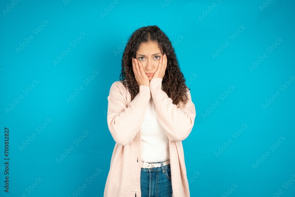 Beautibul teen girl wearing casual clothes Tired hands covering face, depression and sadness, upset and irritated for problem Beautibul teen girl wearing casual clothes Tired hands covering face, depression and sadness, upset and irritated for problem