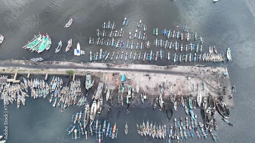 aerial view of the fishing harbor in Muncar, Banyuwangi, Indonesia. fishing boat anchored in the Bali Strait photo