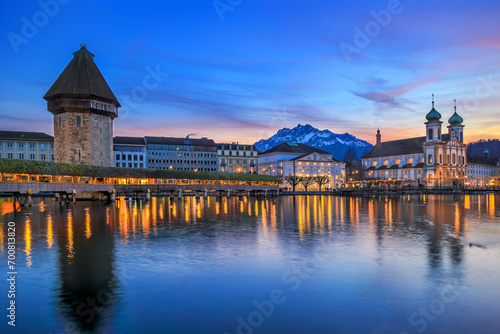 Luzern Kappelbrucke bridge and Jesuten church with Pilatus mountain at background in the evening view, Switzerland © Yü Lan