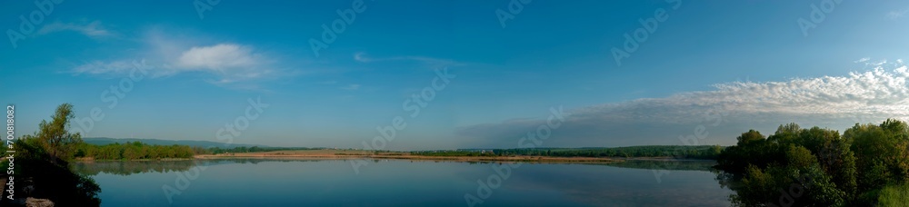 Panorama lake view in sunrise time .Sunrise at the lake Panorama lake view in sunrise time .Sunrise at the lake