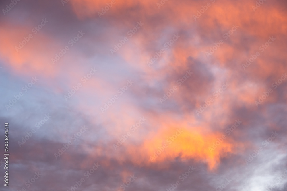 Colorful sunset sky in purples, pinks, oranges, and blues, beautiful cloudscape background