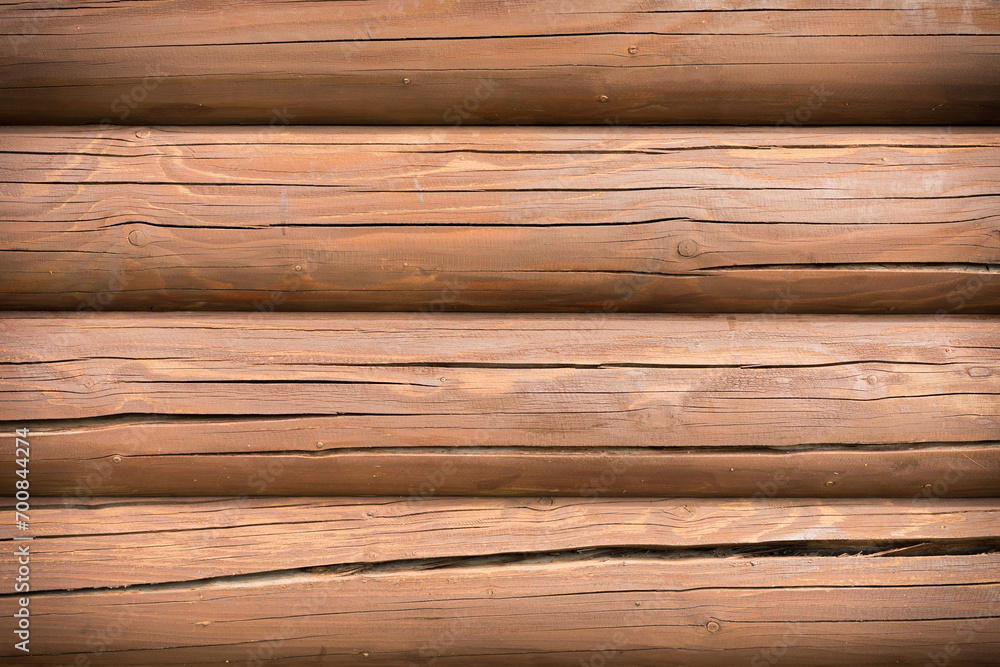 Texture of a red impregnated wooden building wall Texture of a red impregnated wooden building wall