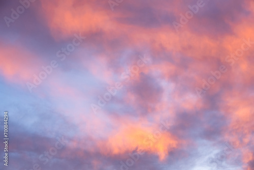 Colorful sunset sky in purples, pinks, oranges, and blues, beautiful cloudscape background
