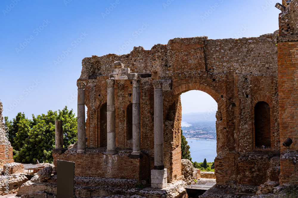 View of old, brick ruins of Ancient Theater of Taormina on a sunny day