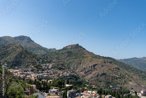 Aerial view of old town of Taormina in sunny day from ancient greek theatre, Sicily, Italy