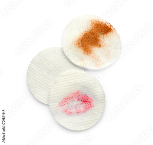 Clean and dirty cotton pads after removing makeup on white background, flat lay