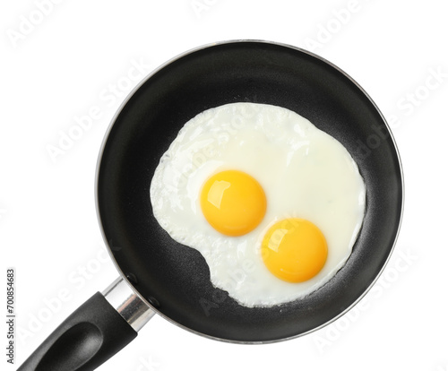 Frying pan with tasty cooked eggs isolated on white, top view