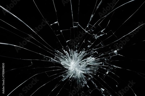 Broken glass on a black background, cracks, shards.