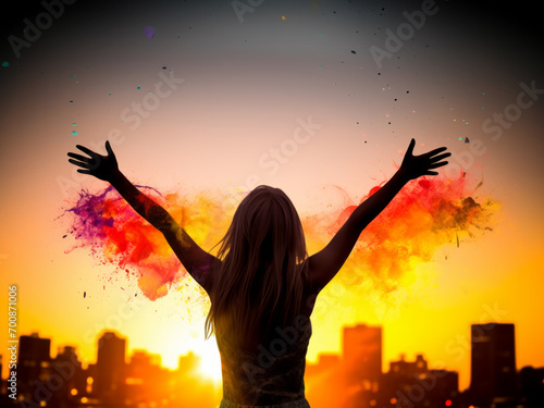 A vibrant image of a triumphant woman with arms outstretched, praising the sun against a colorful backdrop. photo