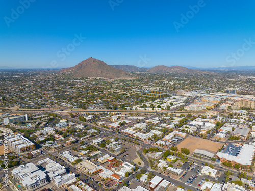 Scottsdale city center aerial view on Scottsdale Road at Main Street with Camelback Mountain at the background in city of Scottsdale, Arizona AZ, USA.  photo
