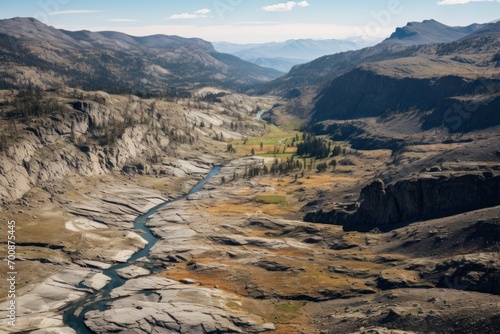 An aerial view of a desolate wilderness, marked by deep crevices