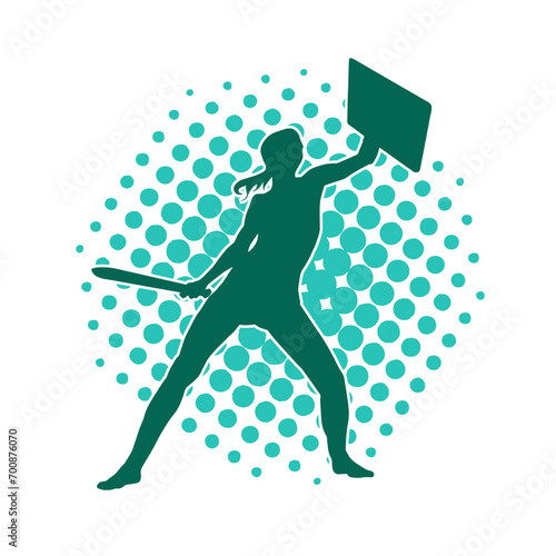 Silhouette of a female warrior in battle armor carrying sword weapon and iron shield.