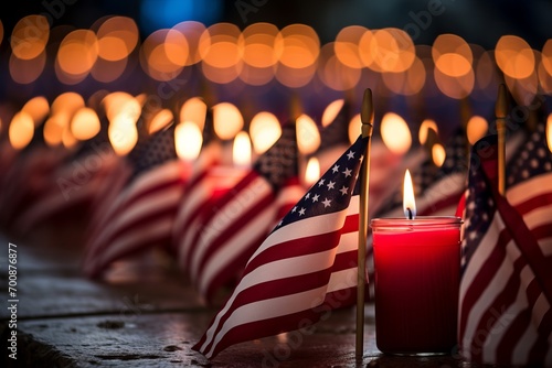 An American flag gently draping over a row of memorial candles on Patriot Day photo