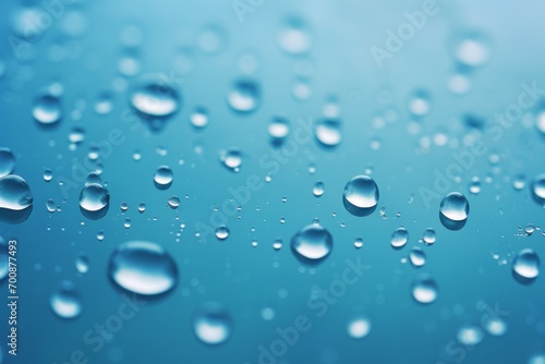 Close-up of raindrops falling into a calm water surface