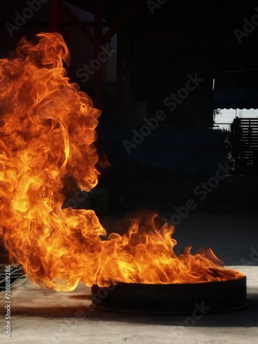 Abstract shapeless fire, large burning fire, simulation of large ignition in oil steel tray, used as basic firefighter training.