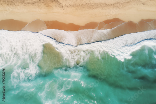 Aerial photography of the seaside with green waves and golden beaches from an overhead perspective