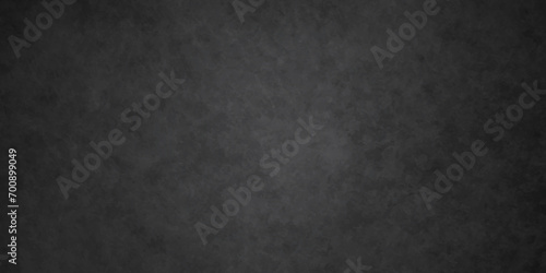 Dark black stone wall grunge backdrop texture background. monochrome slate grunge concrete wall black backdrop vintage marbled textured border background. © armans