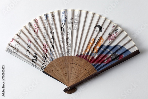 A buchae or traditional Korean fan which is often highly decorated.