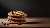 Delicious sweet fresh backed chocolate chip cookies dessert on wood table with black background