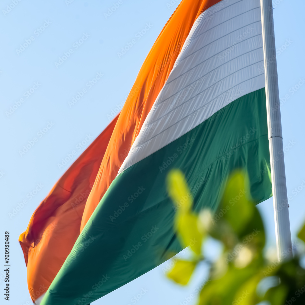 India flag flying high at Connaught Place with pride in blue sky, India