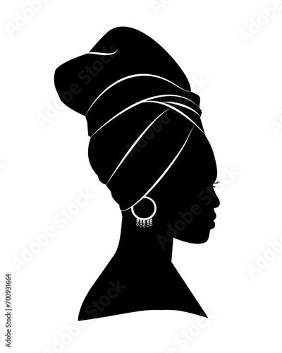 Silhouette of African American woman in a head wrap and an earring. Vector illustration isolated on white