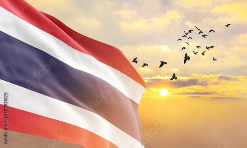 Fotografía Waving flag of Thailand against the background of a sunset or sunrise