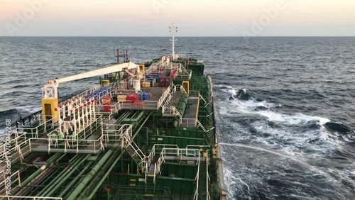 A merchant ship underway, deck view photo