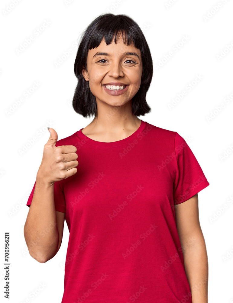 Young Hispanic woman with short black hair in studio smiling and raising thumb up Young Hispanic woman with short black hair in studio smiling and raising thumb up