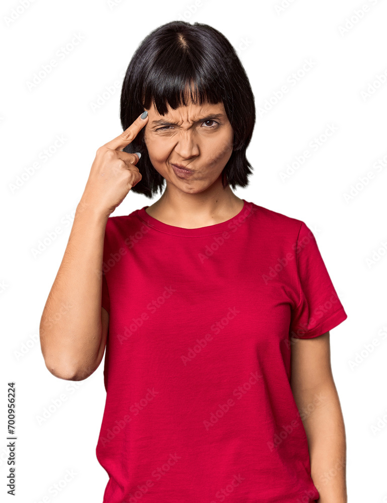 Young Hispanic woman with short black hair in studio pointing temple with finger, thinking, focused on a task. Young Hispanic woman with short black hair in studio pointing temple with finger, thinking, focused on a task.