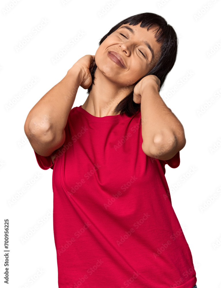 Young Hispanic woman with short black hair in studio feeling confident, with hands behind the head. Young Hispanic woman with short black hair in studio feeling confident, with hands behind the head.