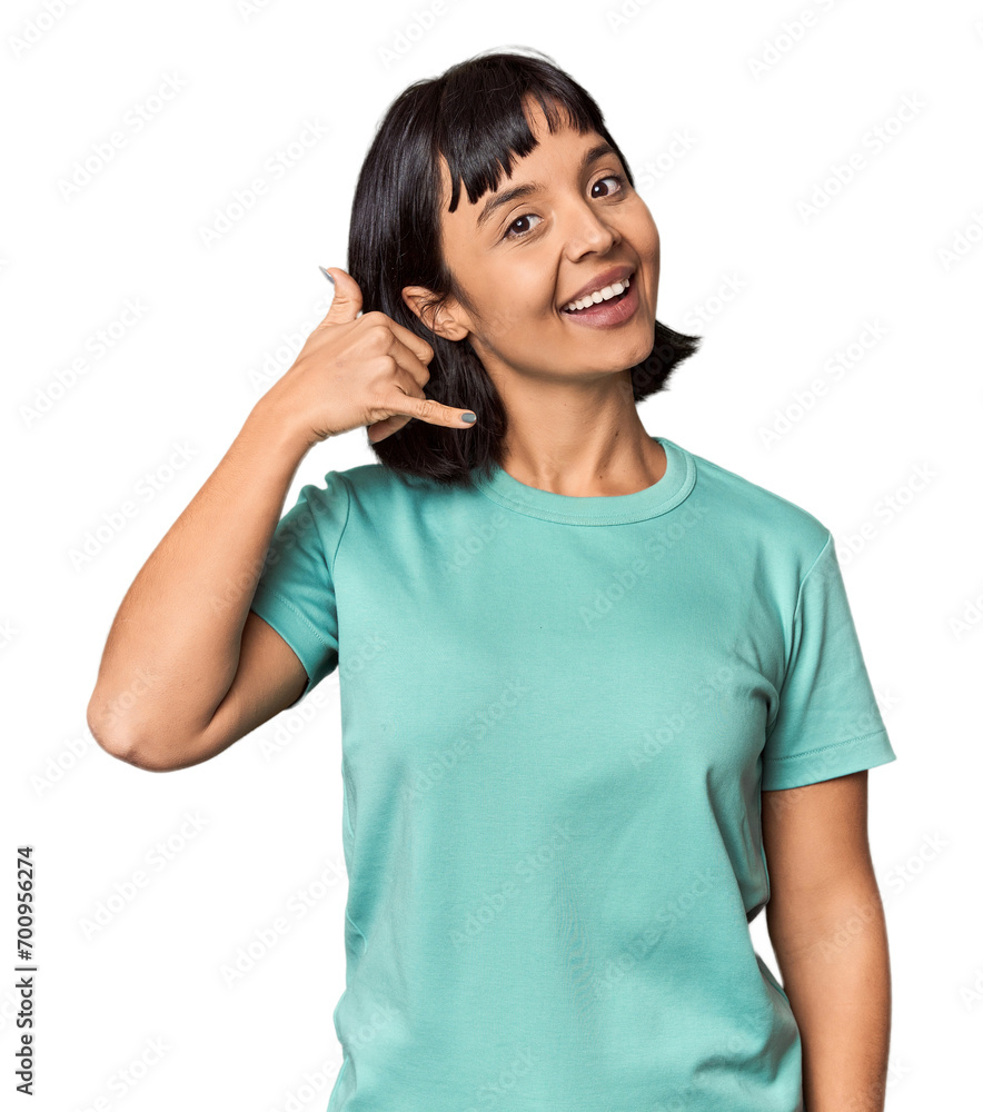 Young Hispanic woman with short black hair in studio showing a mobile phone call gesture with fingers. Young Hispanic woman with short black hair in studio showing a mobile phone call gesture with fingers.