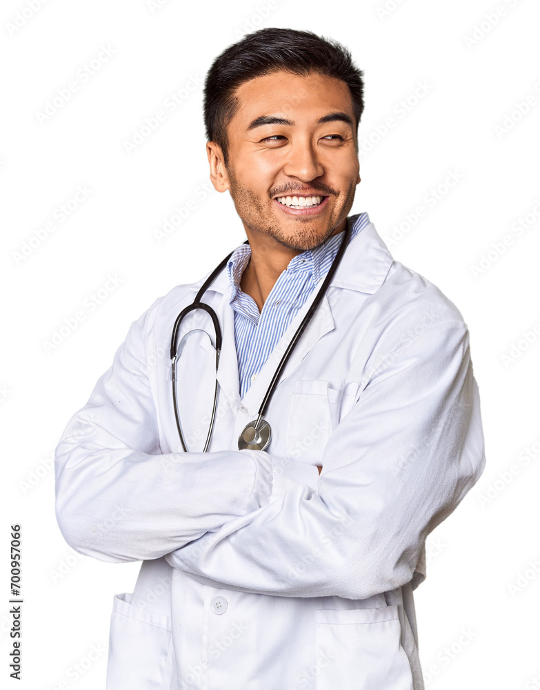 Chinese male doctor posed against studio background Chinese male doctor posed against studio background
