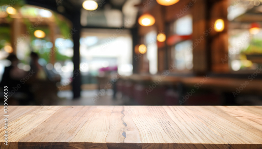 Wooden board empty table in front of blurred restaurant or coffee shop background. can be used for display or montage your products. Mock-up for display of product. Wooden board empty table in front of blurred restaurant or coffee shop background. can be used for display or montage your products. Mock-up for display of product.