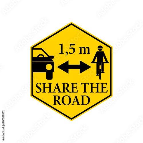 Share the road, pass cyclists safely and keep safety distance. Warning yellow hexagon sign, with car passing a person on a bicycle.