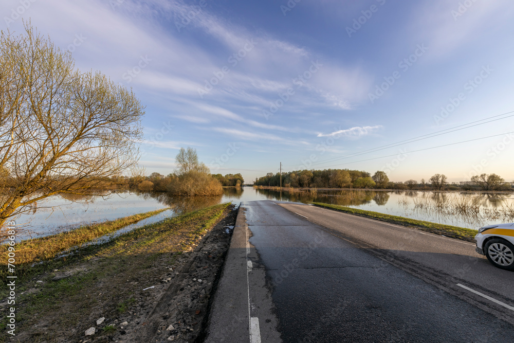 Fototapeta premium Flooded rural roads due to spring floods