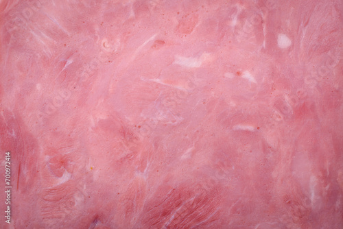 Delicious fresh ham cut into slices with salt, spices and herbs photo