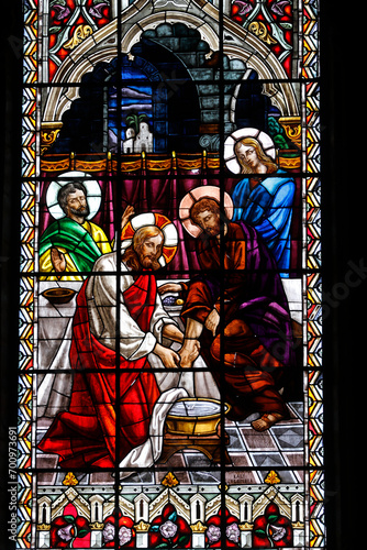 Basilica of the National Vow (Spanish: BasÃ­lica del Voto Nacional), Roman Catholic church located in the historic center of Quito, Ecuador. Stained glass depicting Jesus washing a disciple's feet photo
