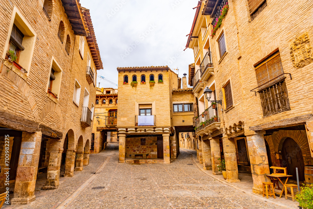 Beautiful square by Rafael Ayerbe. Old Plaza Mayor of the Pyrenean town of Alquezar, Huesca, Spain