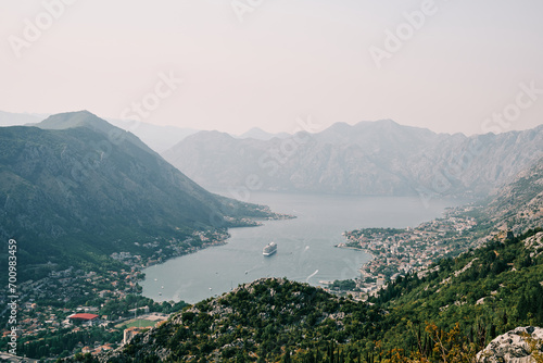 View from the mountain of a large cruise ship sailing in the Bay of Kotor. Montenegro