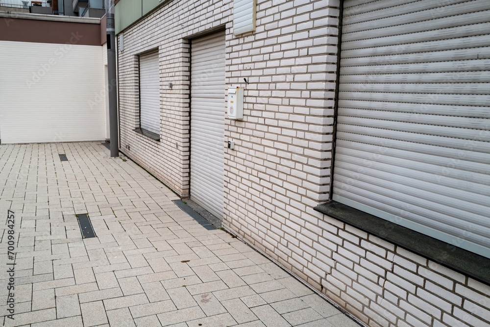 Fototapeta premium Building with windows and shutters, backyard corner
